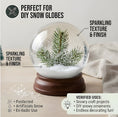 Load image into Gallery viewer, Demonstrating artificial snow used for creating miniature winter village scenes and crafting DIY snow globes.
Image 7: