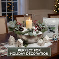 Load image into Gallery viewer, Holiday dining table centerpiece featuring a hurricane candle, pinecones, green sprigs, white ceramic houses, and artificial snow flakes.