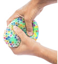 Load image into Gallery viewer, Person squeezing a colorful stress ball made from a DIY Stress Ball Kit, showcasing stress-relief activity.