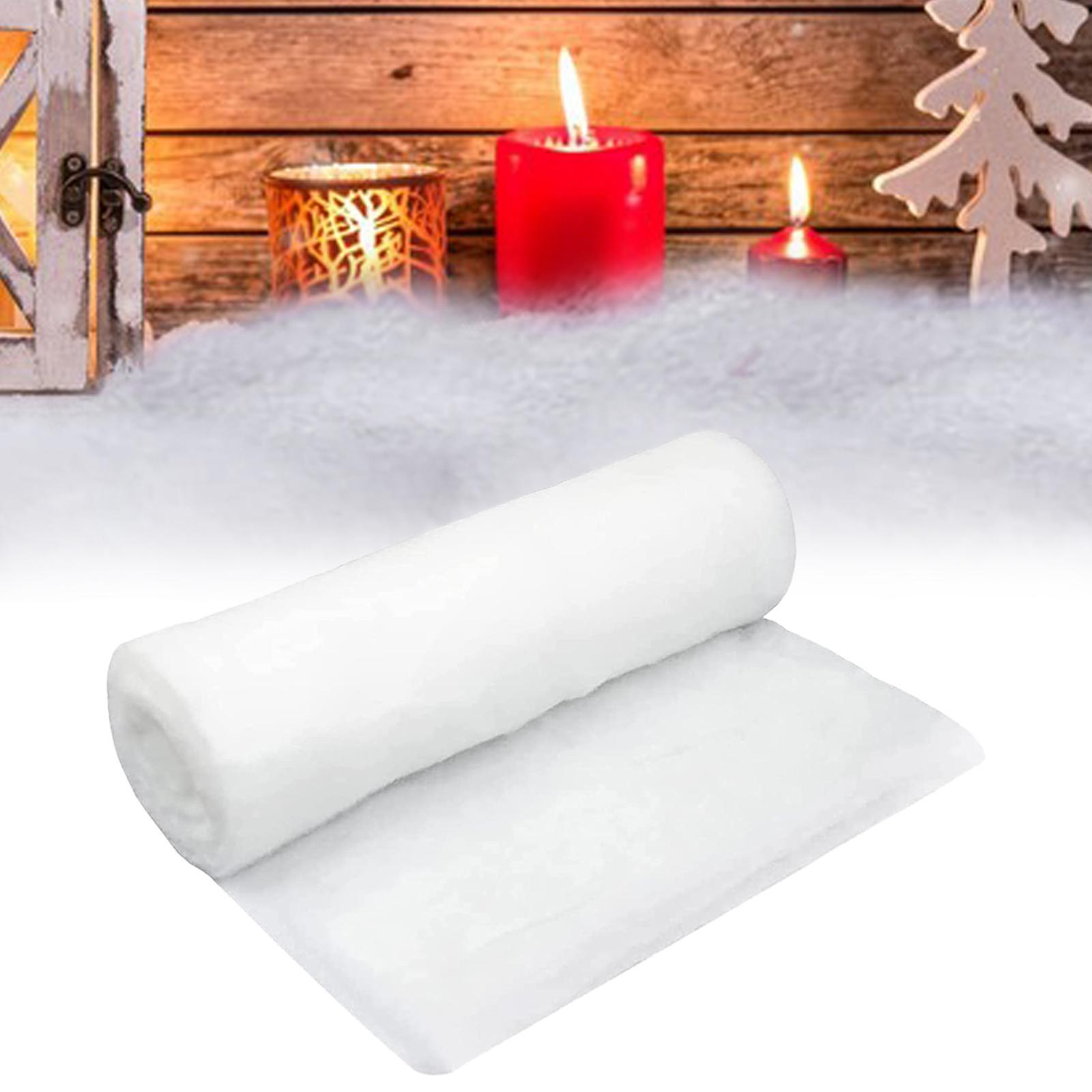 Ultra-Realistic Flame-Retardant Snow Blanket displayed in a cozy holiday setting with candles and winter decorations.