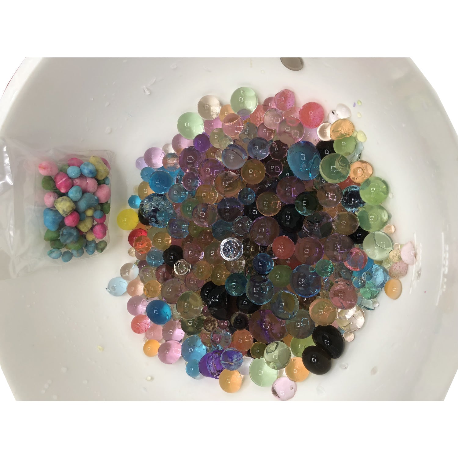 Split-screen demonstration of Kid's Party Favor Science Project Kits – Magic Stone showing stones before and after expanding into gel marble balls